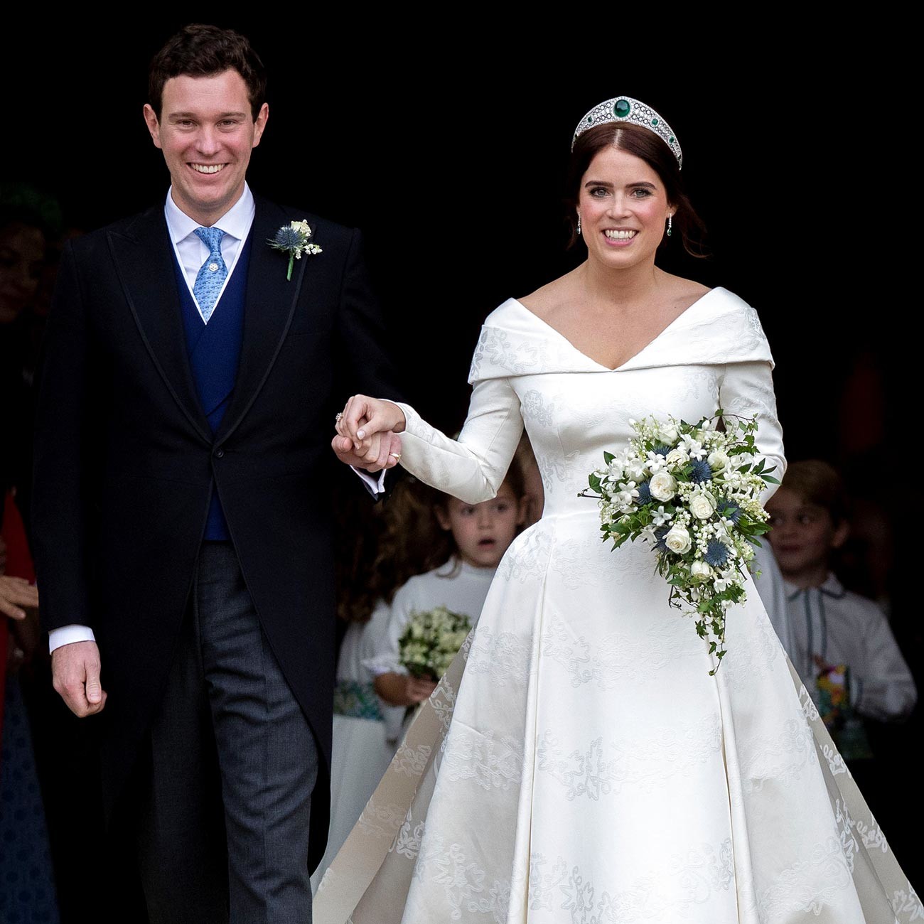 Putri Eugenie dan Jack Brooksbank meninggalkan Kapel St. George di Kastil Windsor setelah upacara pernikahan mereka pada 2018.