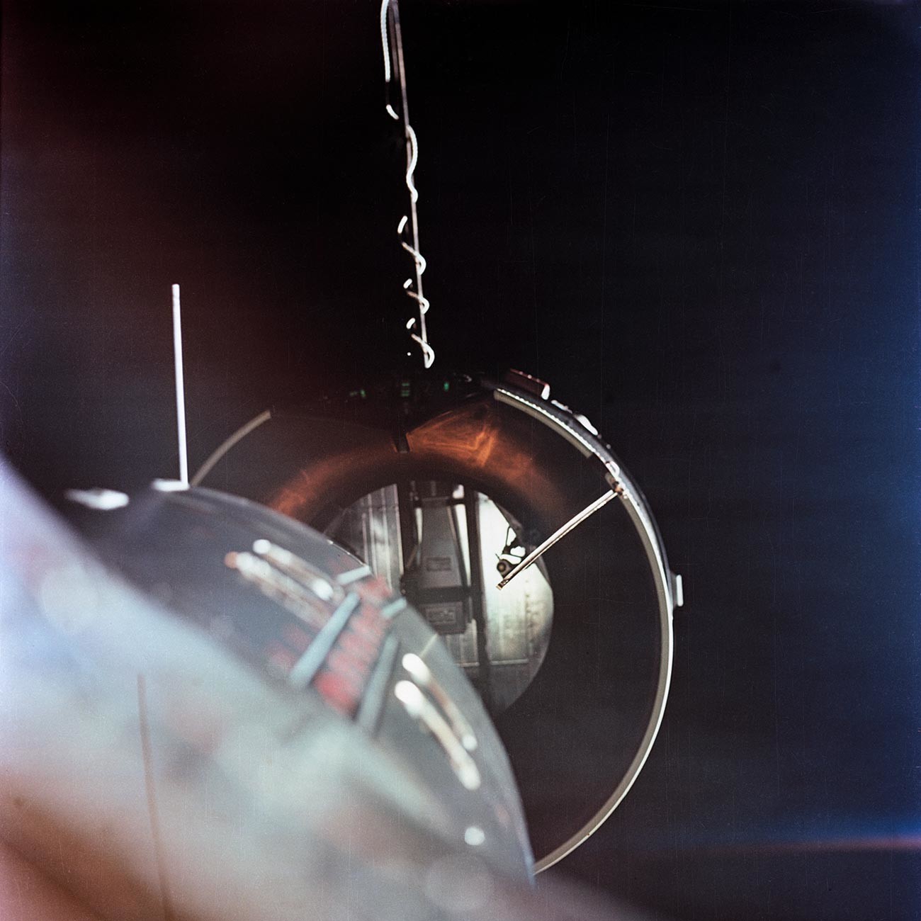 The Agena Target Docking Vehicle seen from the National Aeronautics and Space Administration's Gemini adapter of the Agena is approximately two feet from the nose of the spacecraft (lower left).
