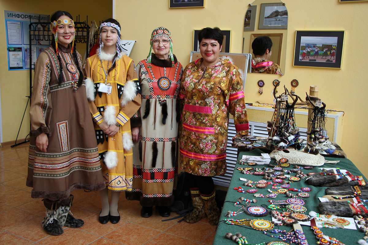 Left to right: Ksenia Kiyaikina, a dancer at the local ensemble, Diana Shumkova, a student of the Aleutian weaving class, Nina Kiyaikina, a teacher of this class, Galina Korolyeva, chairman of the Aleutsky Municipal District duma.