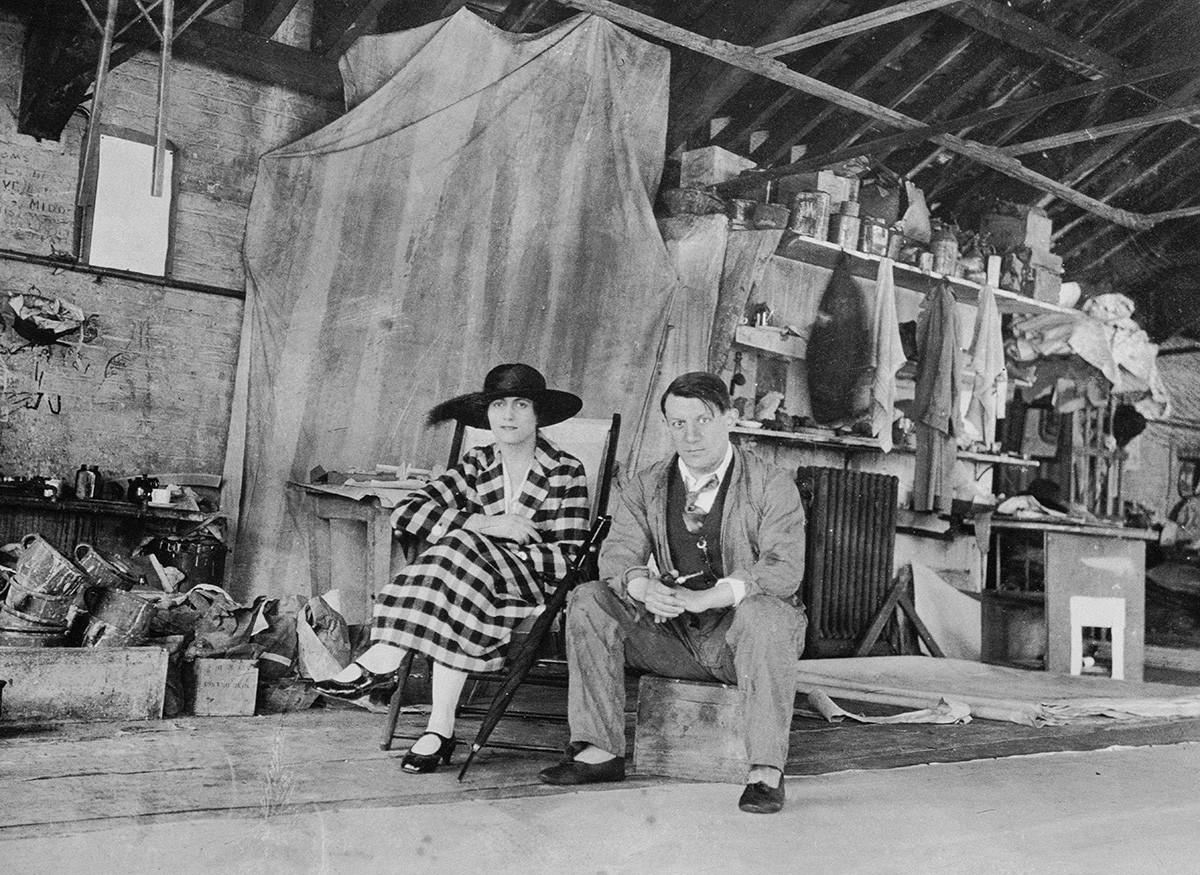 Pablo Picasso and Olga Khokhlova in the painting studio in London, 1919.