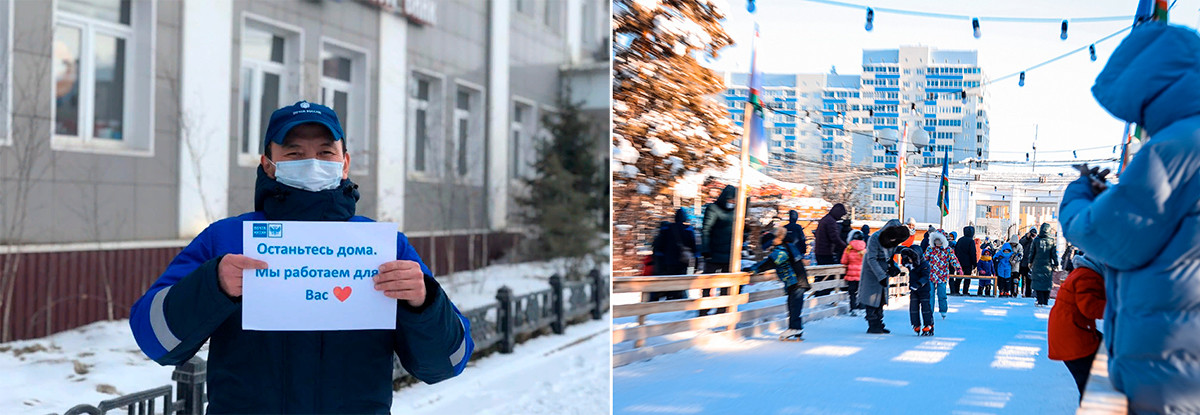 Seorang karyawan Pos Rusia memegang spanduk bertuliskan 
