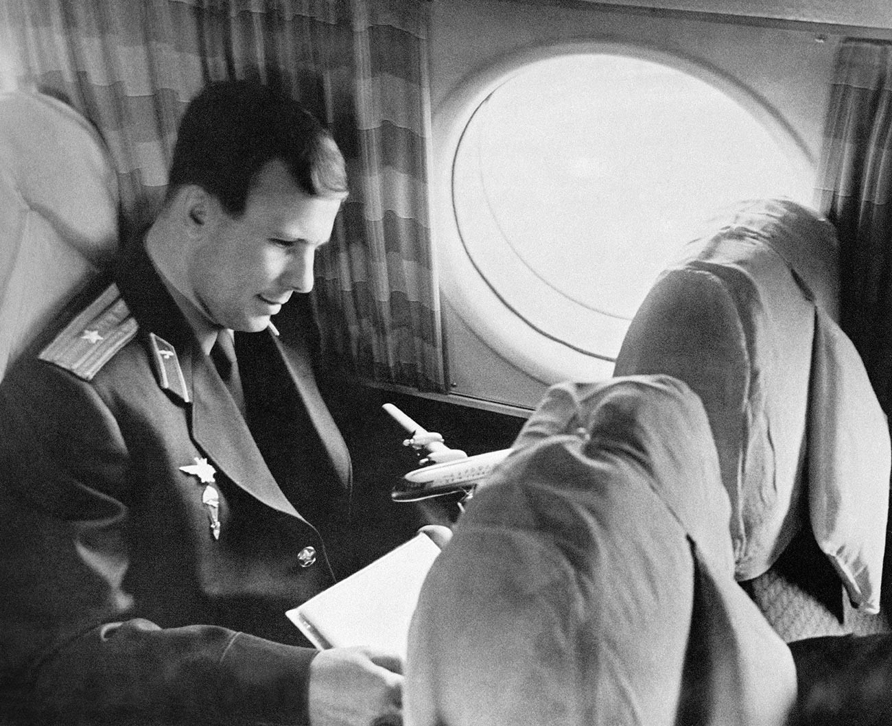 Юрий Алексеевич Гагарин в самолете