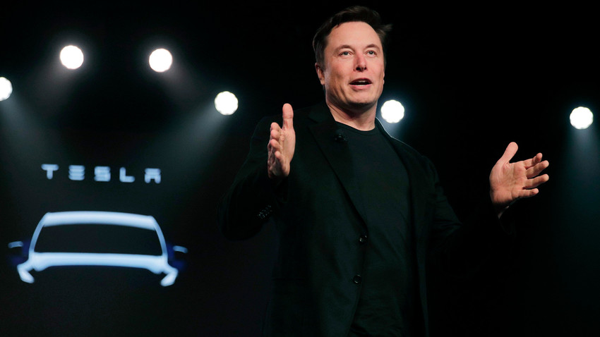 Tesla CEO Elon Musk speaks before unveiling the Model Y at Tesla's design studio in Hawthorne, Calif.