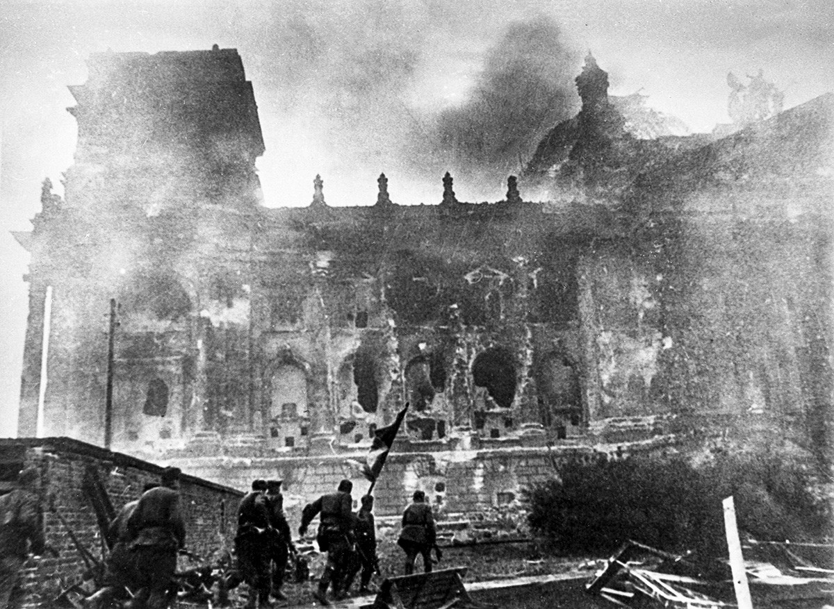 Soviet troops storm the Reichstag.