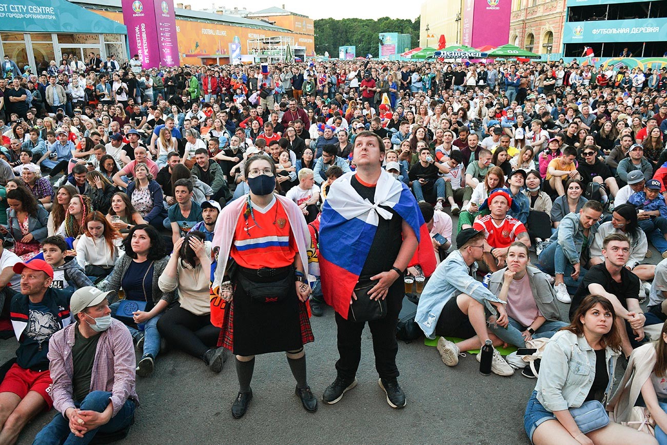 Fans watch the broadcast of the match of the 1st round of the group stage of the European Football Championship 2020 between the national teams of Belgium and Russia in the UEFA Euro 2020 football village in St. Petersburg