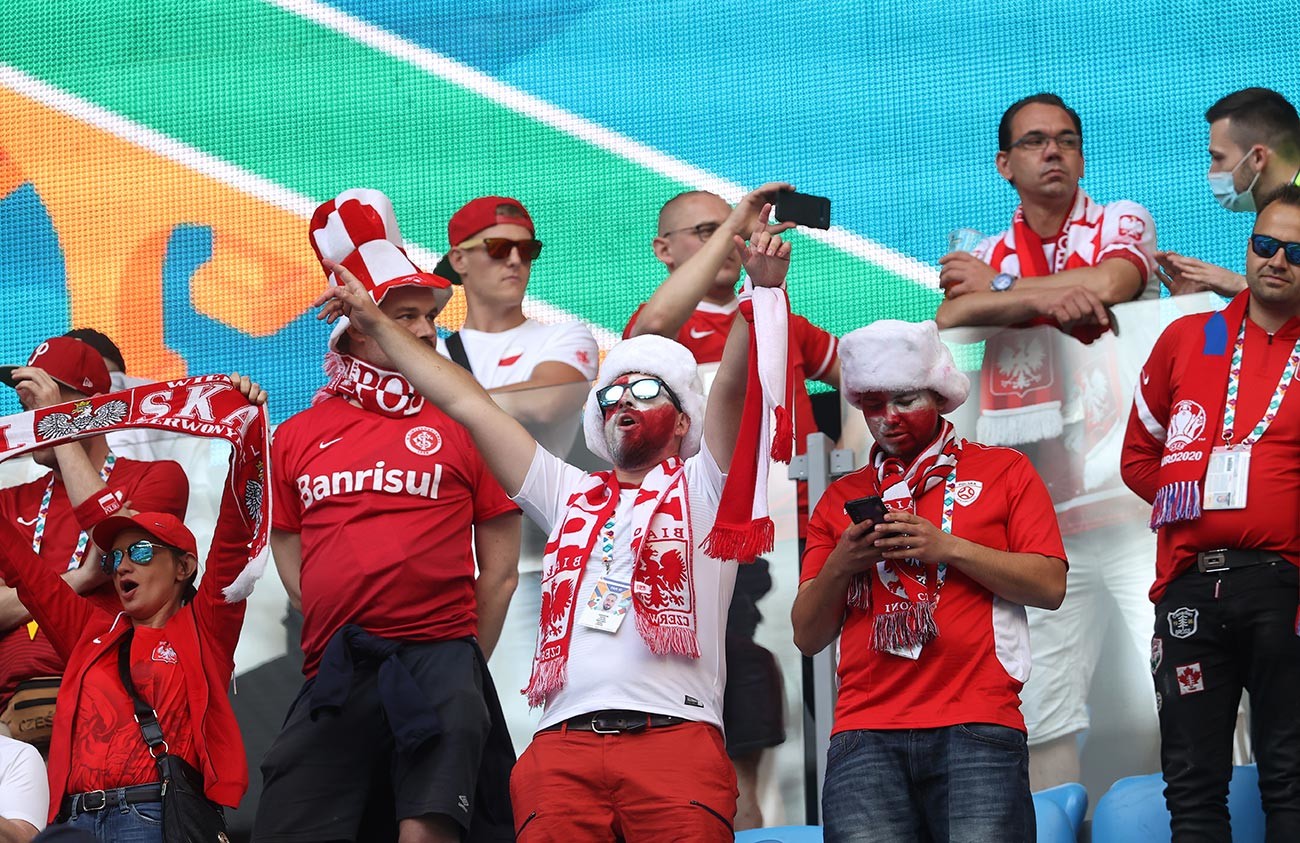 Fans of Poland show their support prior to the UEFA Euro 2020 Championship Group E match between Poland and Slovakia at the Saint Petersburg Stadium on June 14, 2021 in Saint Petersburg, Russia