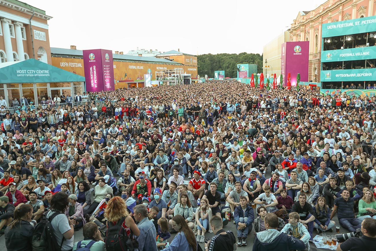 Fans watching the broadcast of the UEFA EURO 2020 European Football Championship match between Belgium and Russia at the UEFA EURO 2020 Festival Village on Konyushennaya Square.