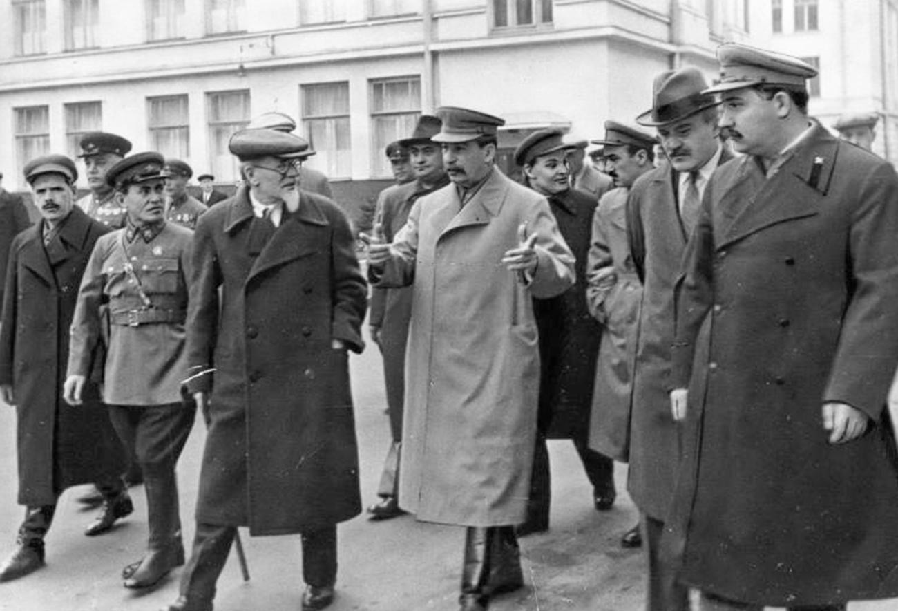 Joseph Stalin and senior Soviet statesmen walking in Moscow.
