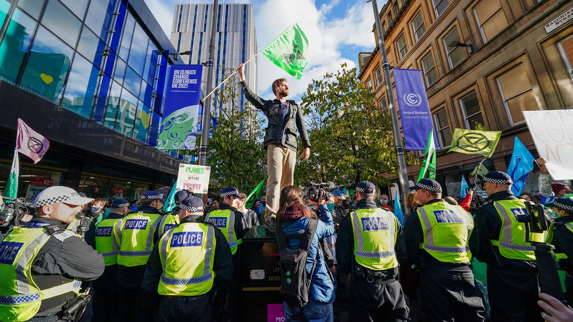 Police and demonstrators at an Extinction Rebellion protest on Buchanan Street, during the Cop26 summit in Glasgow.