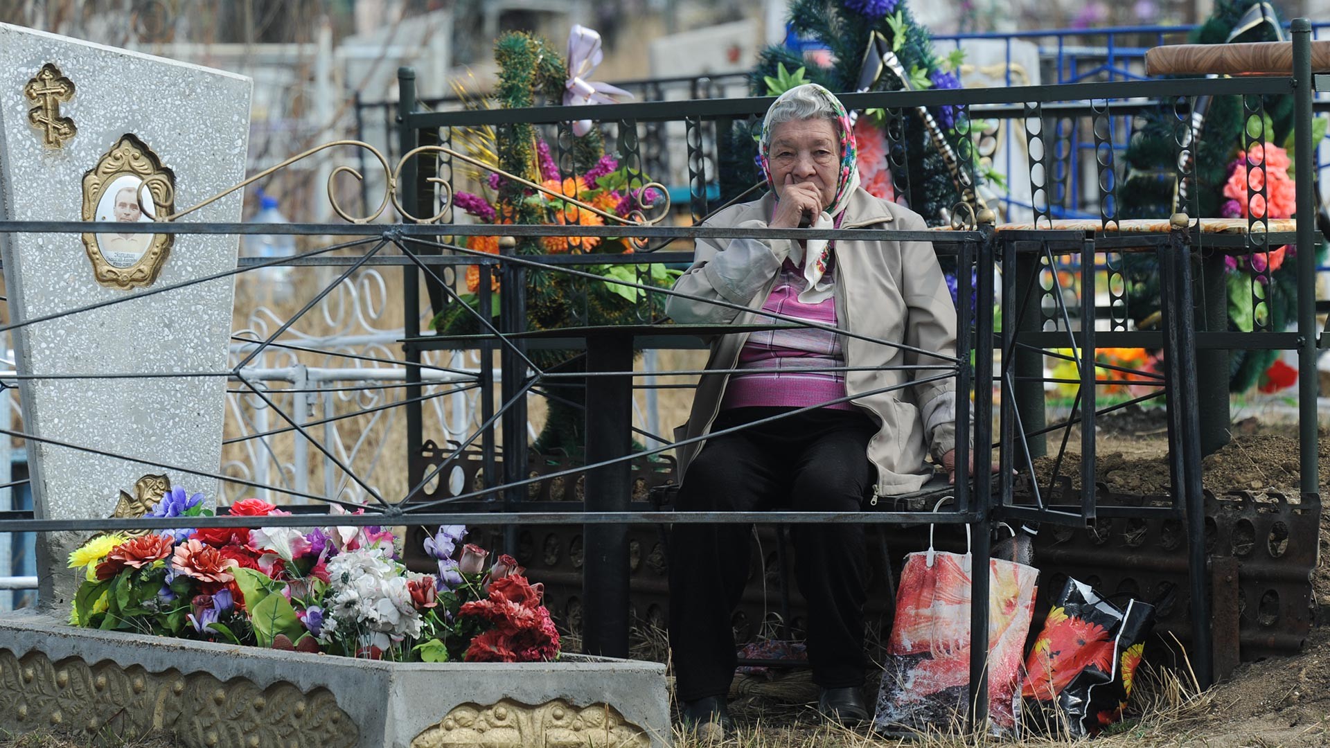 A Russian woman at a cemetery in Chita.