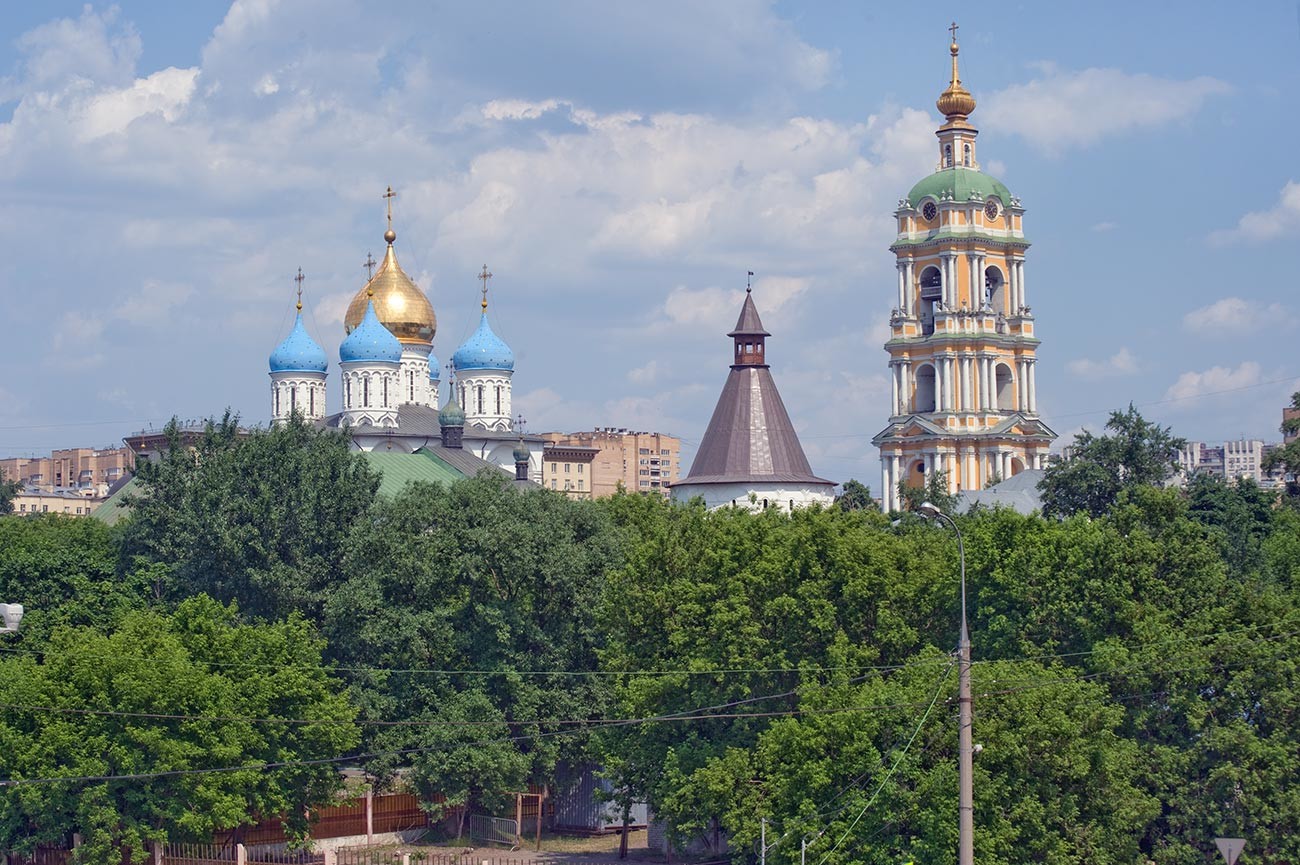 Moscow. Novospassky (New Savior) Monastery, southeast view from Novospassky Bridge over Moscow River. From left: Transfiguration Cathedral, southeast tower, bell tower. May 25, 2014