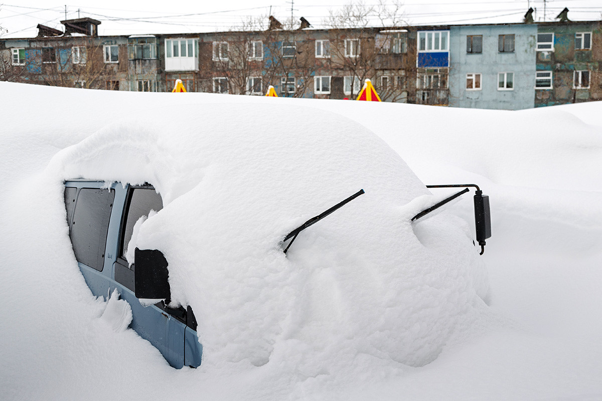 Car under the massive snow

