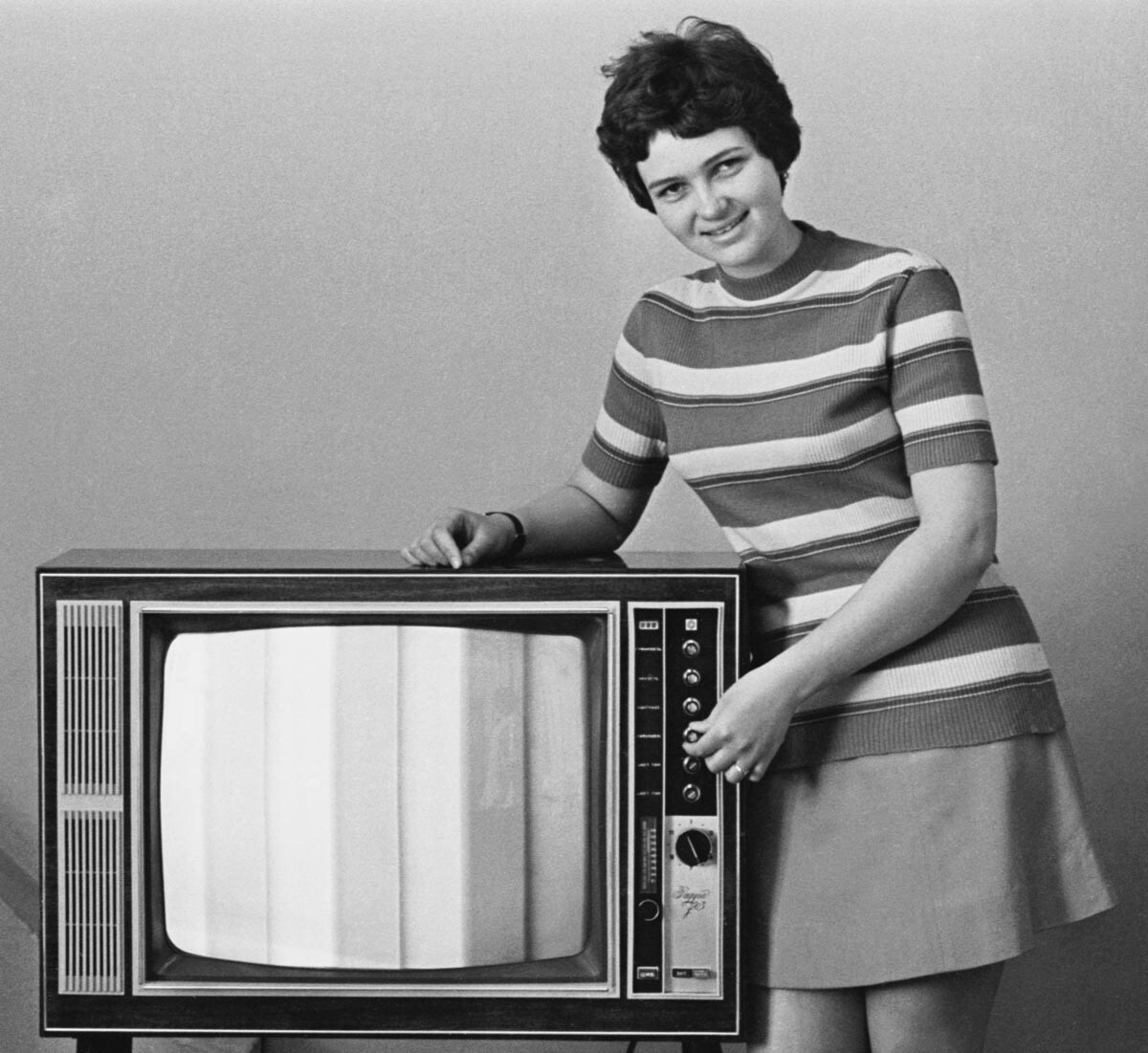 The USSR. Leningrad. On May 2, 1973, the installer Anna Savelyeva during a demonstration of the Rainbow-303 color TV