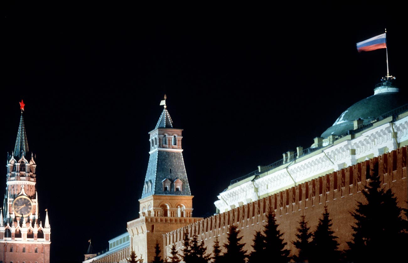 The three-colored Russian flag flying over the Moscow Kremlin