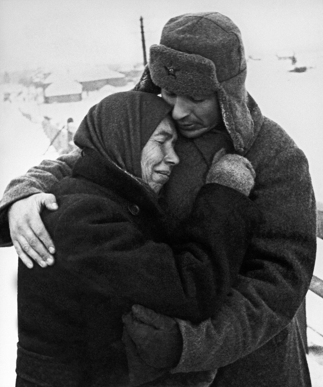 A woman embracing a Soviet soldier in a liberated village.