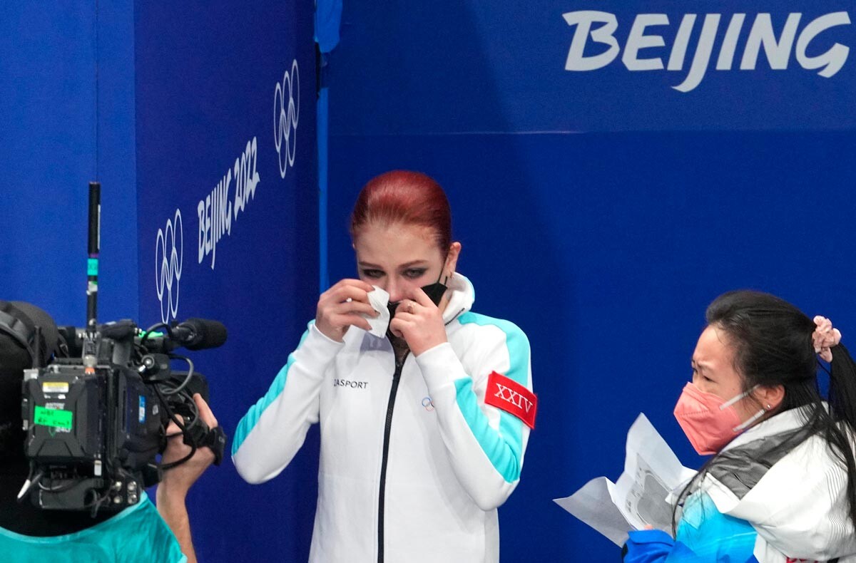 Silver medalist Alexandra Trusova reacts on the women's free skating results