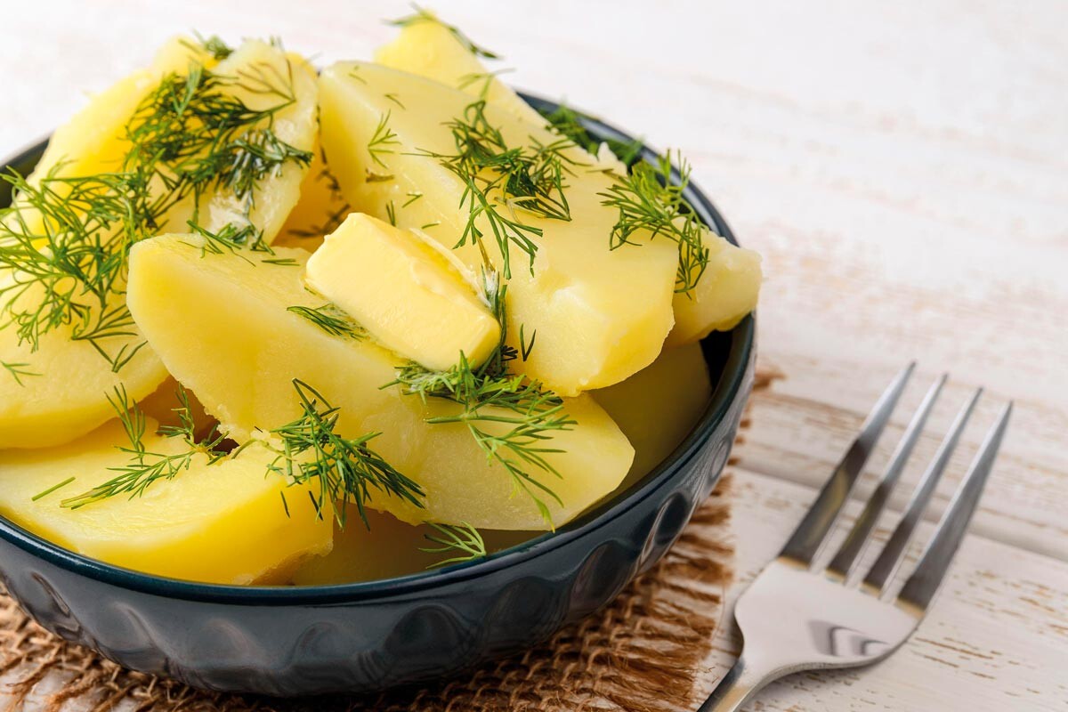 Boiled potato with butter and dill.