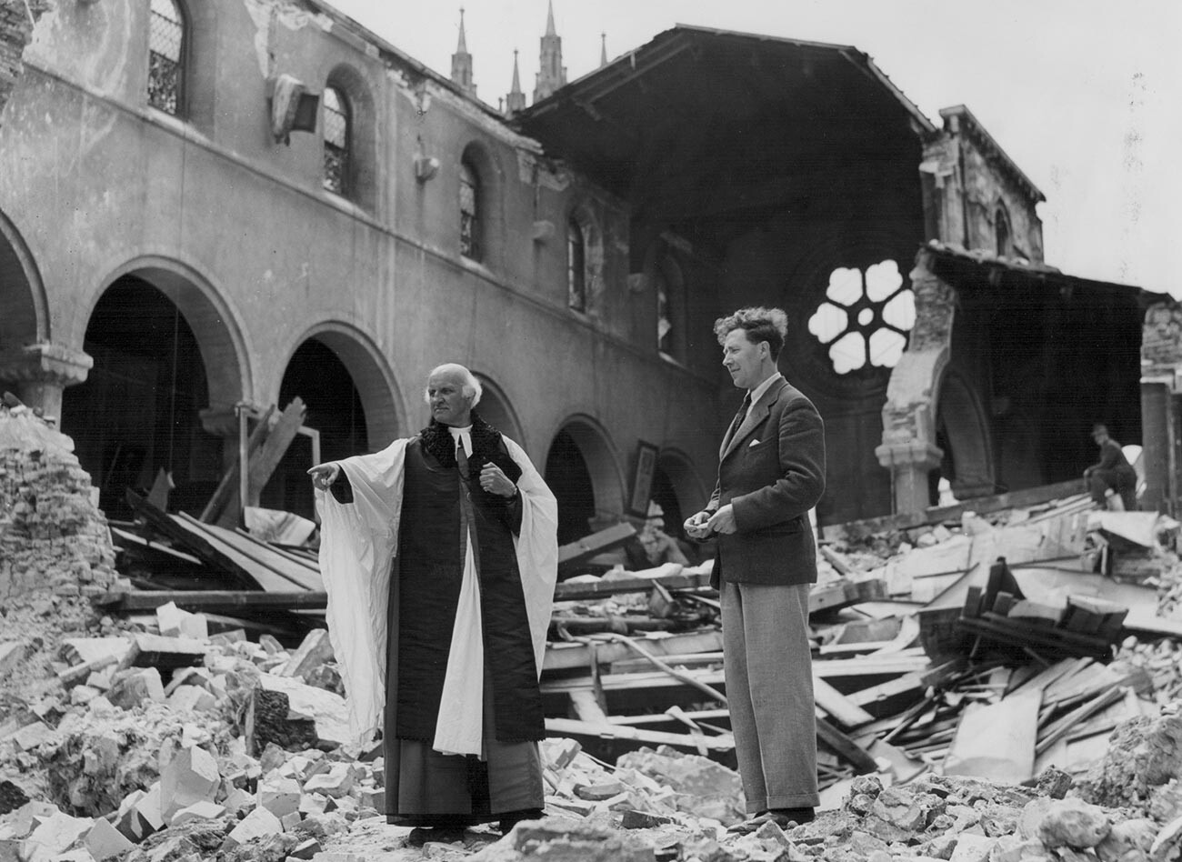 Reverend Dr Hewlett Johnson and his secretary surveying the destroyed Cathedral Library, June 1942.
