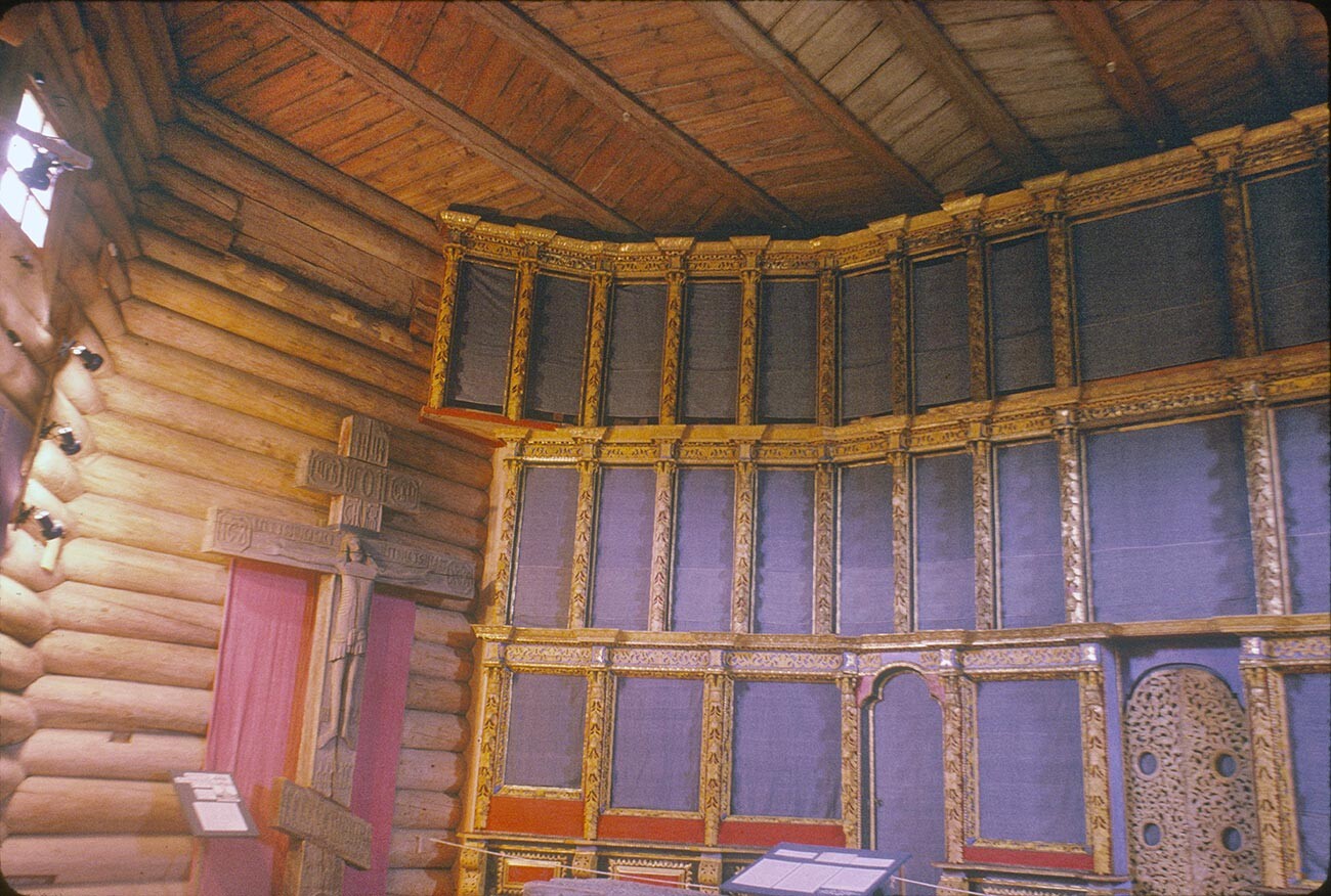 Malye Korely. Church of St. George from Vershina. Interior, view northeast with ornamental icon screen frame. Left: carved wooden crucifix. July 27, 1998