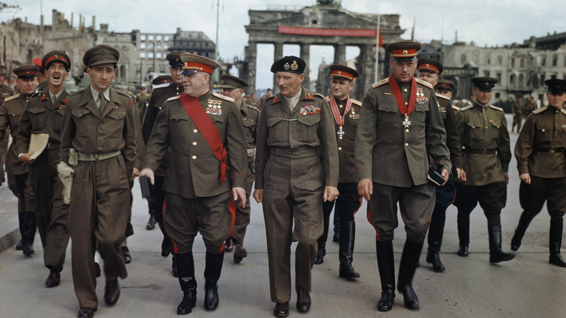 British Field Marshall Bernard Montgomery, Marshals of the Soviet Union Georgy Zhukov and Konstantin Rokossovsky leave the Brandenburg Gate after a ceremony to decorate Soviet Generals, Berlin, 12th July 1945.