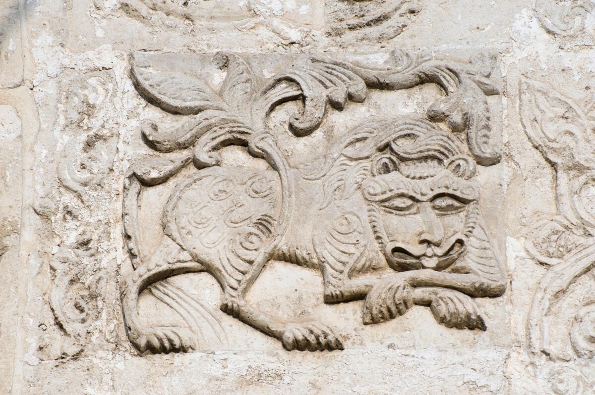 Cathedral of St. George. West facade, carving of heraldic lion with foliate tail. August 21, 2013