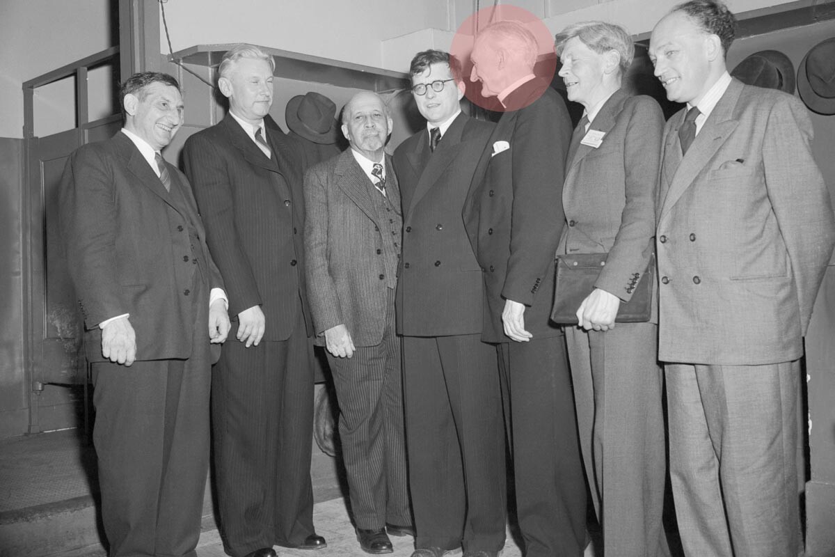 From left to right: American writer John Howard Lawson, Soviet writer Alexander Fadeev, sociologist William Edward Burkhardt Dubois, composer Dmitry Shostakovich, Bishop Arthur Moulton, William O. Stapledon, and Kiri Hrovek at the Cultural and Scientific Conference on World Peace in New York