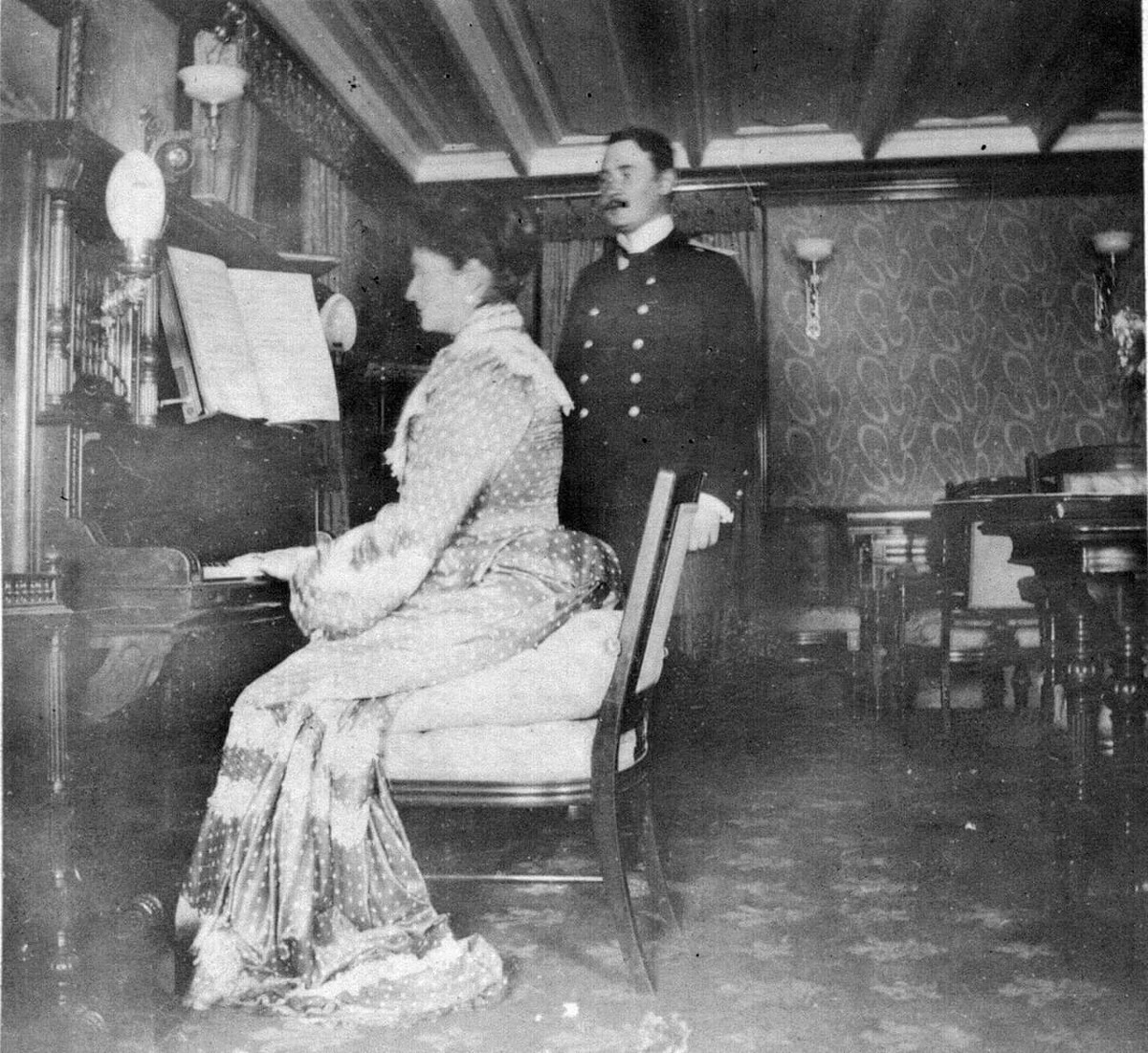 Empress Alexandra Fedorovna playing piano.