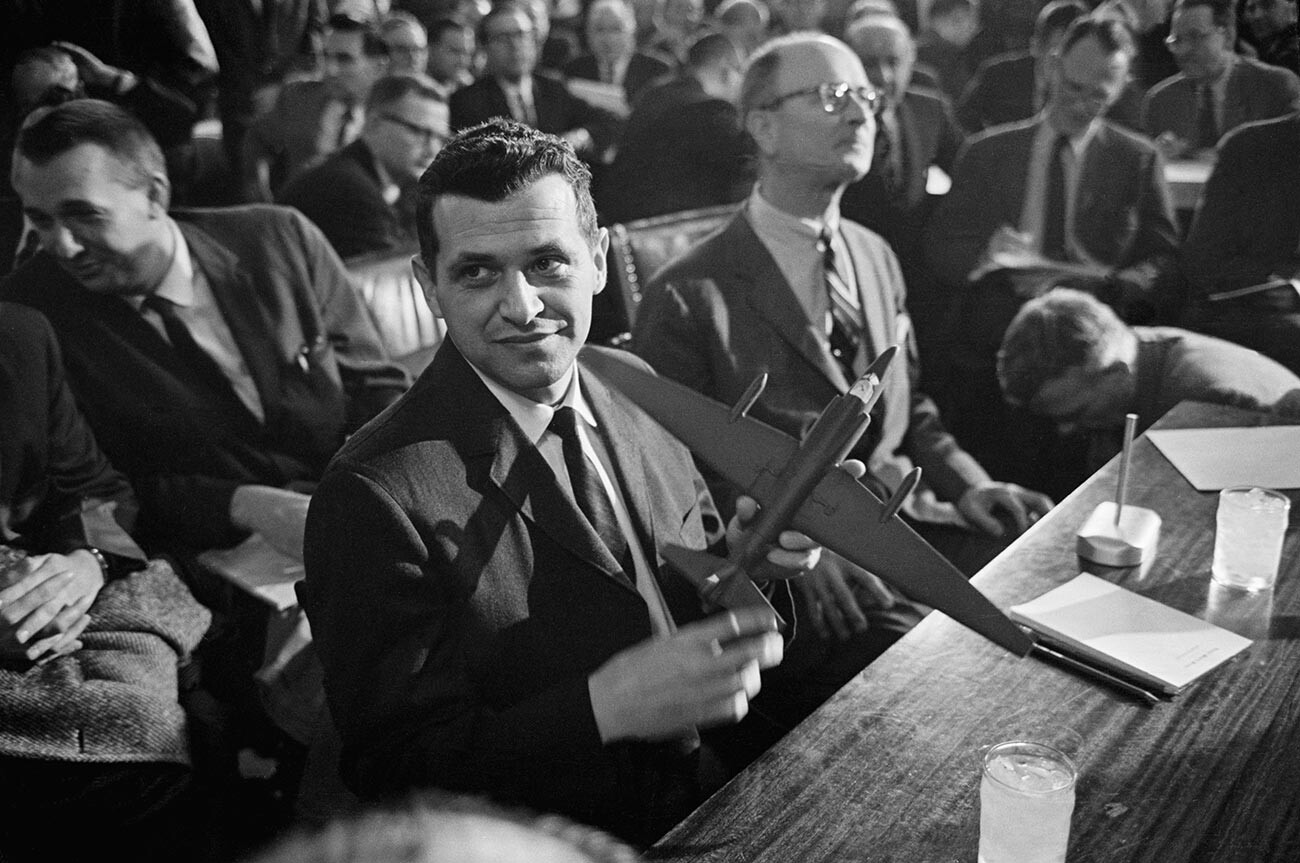 Francis Gary Powers holds a model of a U-2 spy plane as he testifies before the Senate Armed Services Committee.