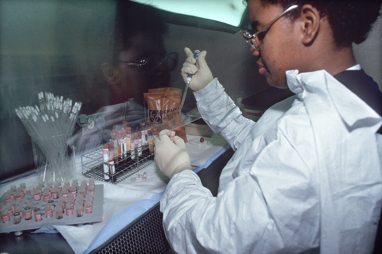 A laboratory technician tests blood samples for HIV and/or AIDS, New York, New York, December 11, 1986.