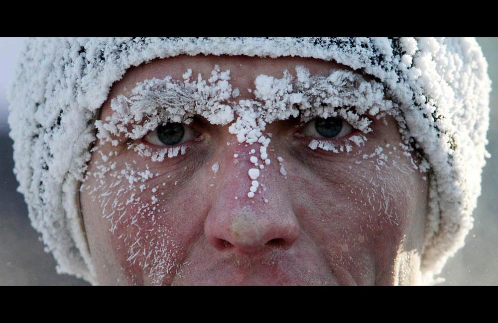 A participant runs during a traditional Christmas Half Marathon in Omsk at air temperatures of  -30 C.