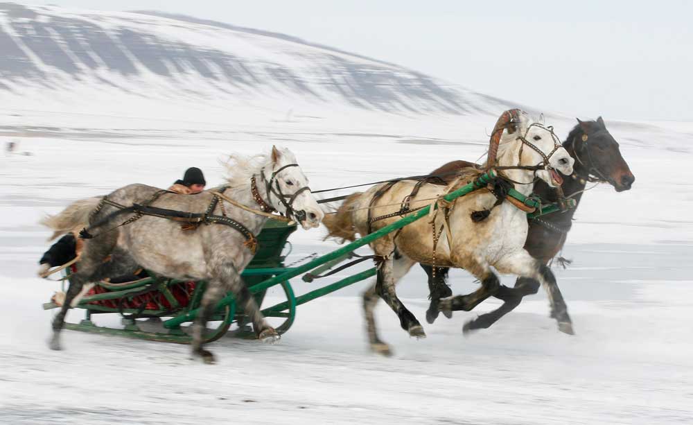 Riders compete on the frozen Yenisei river during the Ice Derby amateur horse race, which has been held annually at the end of each winter since 1969.