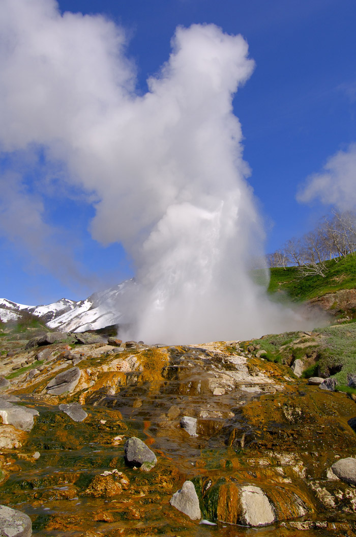 The primary attractions include twelve active volcanoes, thermal lakes, waterfalls and geysers. Pictured is the so-called "Giant Geyser."