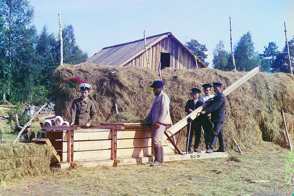 Baling machine for hay, Murmansk. 1915 // Throughout the years, Prokudin-Gorsky's photographic work, publications and slide shows to other scientists and photographers in Russia, Germany and France earned him praise.