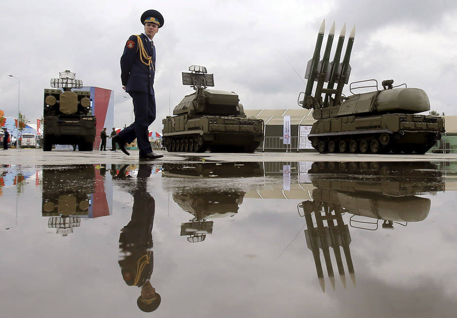 A Russian serviceman walks past the Buk-1M missile system at the Army-2015 international military forum in Kubinka, outside Moscow, Russia, June 16, 2015.