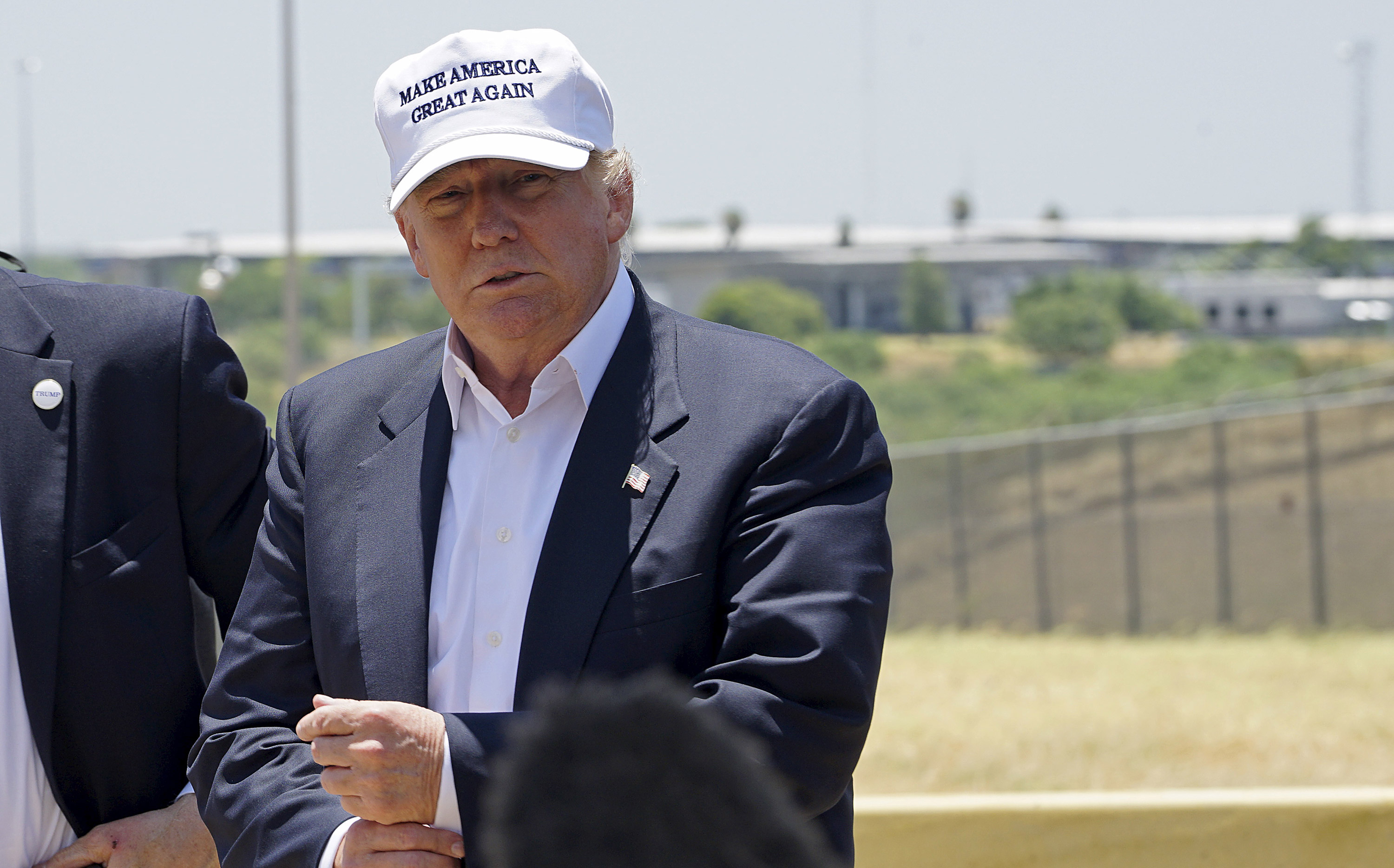 Republican presidential candidate Donald Trump attends a news conference near the U.S.-Mexico border (background), outside Laredo, Texas July 23, 2015. 