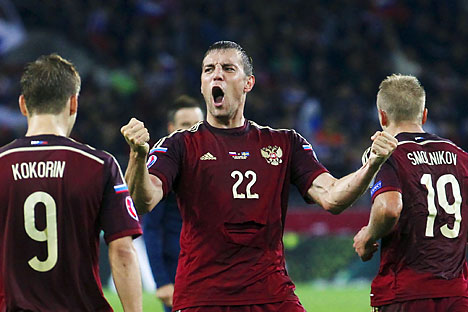 TEAM RUSSIA IS PLAYING AGAINSTRussia's Artem Dzyuba (C) celebrates with team mates Aleksandr Kokorin (L) and Igor Smolnikov after scoring against Sweden during their Euro 2016 group G qualification match at the Otkrytie Arena stadium in Moscow, Russia, September 5, 2015. 