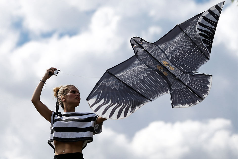 MOSCOW, RUSSIA. AUGUST 2015. A young girl flies a kite during a summer kite festival in the Setun River Valley nature reserve