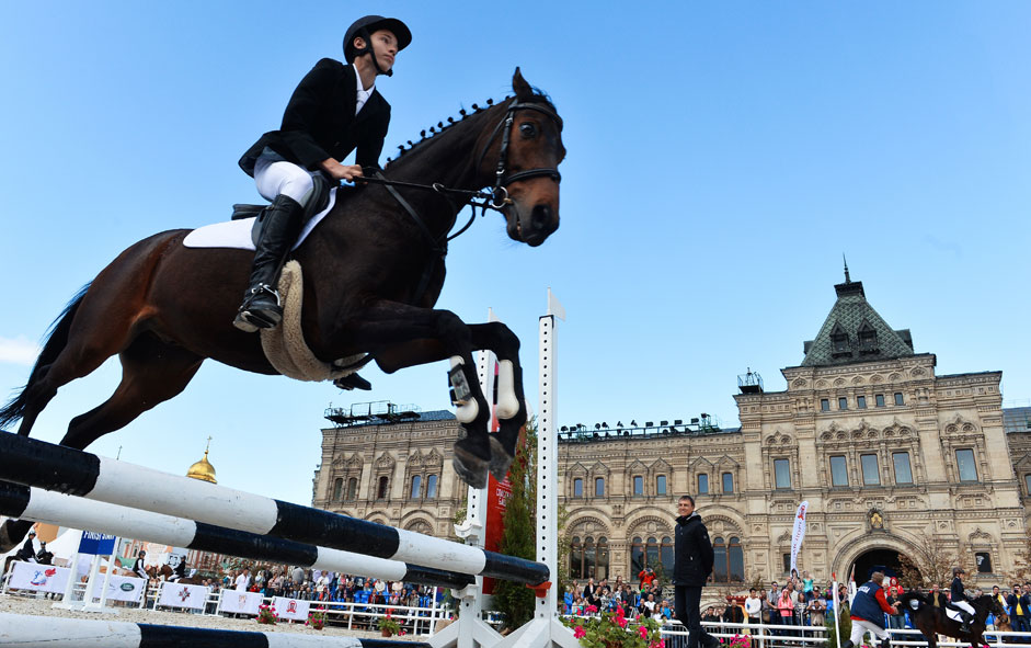 Member of show jumping "Life, not just a sport" in the framework of the International Military Music Festival "Spasskaya Tower" in the equestrian arena Kremlin riding school, posted on the Red Square in Moscow on Aug. 20, 2015. 