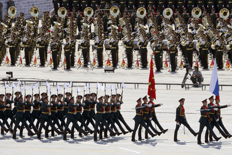 Russian soldiers march as the military band plays during a military parade to mark the 70th anniversary of the end of World War Two, in Beijing, China, September 3, 2015.