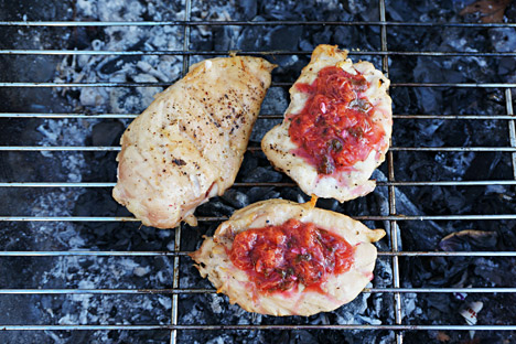 Chicken over coals with Georgian plum sauce. Source: Anna Kharzeeva