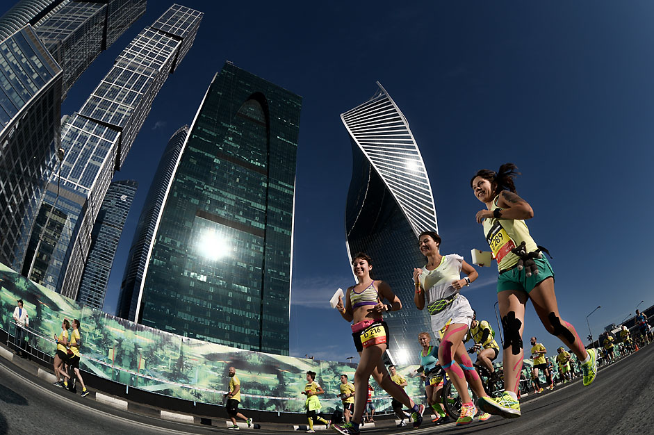 Participants of the Moscow Marathon in front of the Moscow City business center.