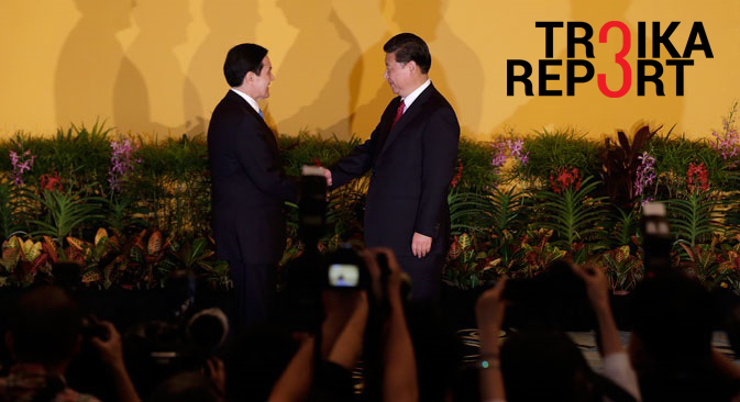 Chinese President Xi Jinping (R) and Taiwanese President Ma Ying-Jeou shake hands at the Shangri-La Hotel in Singapore, Nov. 7, 2015