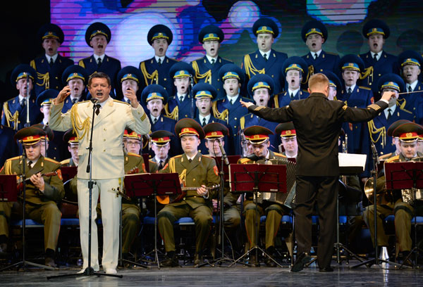Members of the Alexandrov Russian Army song and dance ensemble perform at the VII International Winter Festival Arts, part of the cultural program at the XXII Olympic Winter Games in Sochi. Left: soloist Vladimir Ananev.