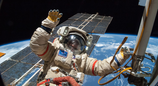 A Russian cosmonaut floats free from politics outside the International Space Station.