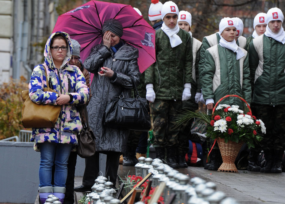 Moscow residents during an event commemorating the 13th anniversary of the hostage crisis that occurred during the performance of the musical Nord-Ost at the Dubrovka Theater in Moscow.