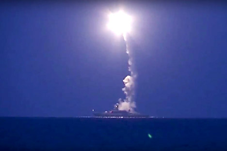 In this photo made from the footage taken from Russian Defense Ministry official web site, Oct. 7, 2015, a Russian navy ship launches a cruise missile in the Caspian Sea.