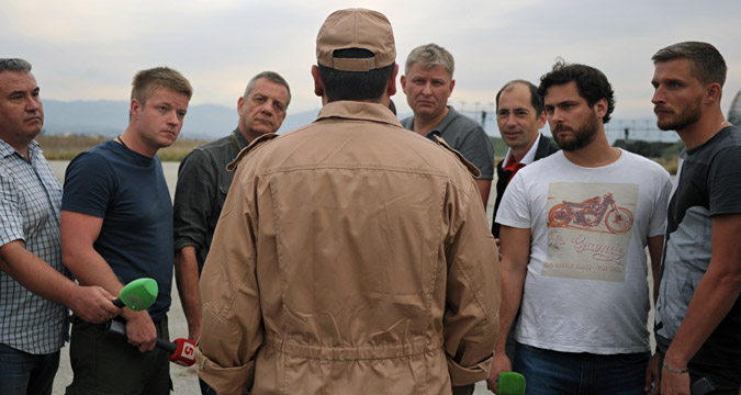 Rescued pilot of the Russian Air Force's Su-24 jet, Captain Konstantin Murakhtin, center, answers journalists' questions at Khmeimim Air Base in Latakia.