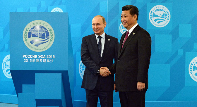 Russian President Vladimir Putin, left, and Chinese President Xi Jinping ahead of the Shanghai Cooperation Organization (SCO) summit in Ufa, Russia, July 10, 2015.