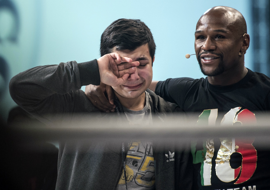 Floyd Mayweather, right, during open training session in Moscow at the Rossiya State Concert Hall.