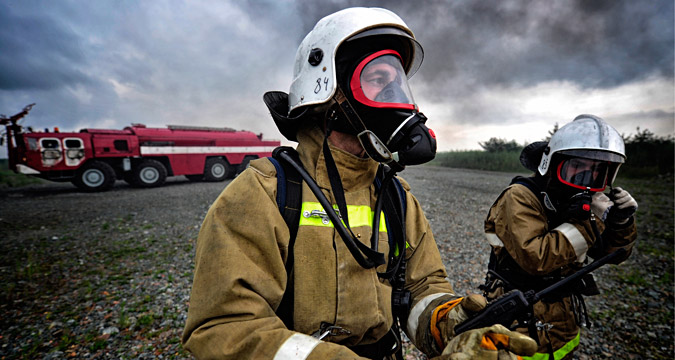 VLADIVOSTOK, RUSSIA. AUGUST 10, 2015. Fire fighters in a routine emergency exercise at Knevichi International Airport.